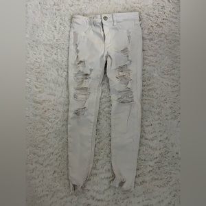 American Eagle NE(X)T LEVEL STRETCH White Distressed Skinny Jeans